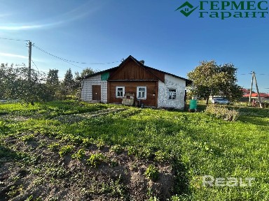 Деревянный дом с кирпичной пристройкой